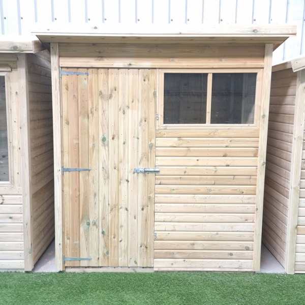 Custom-made Pent Shed by Websters Timber with sloping roof, shiplap cladding, and single door.